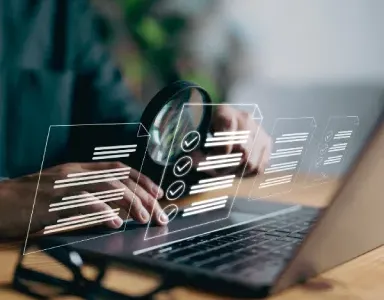 A person using a laptop with holographic checklists, symbolizing analysis.